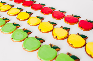 Delicious gingerbread in the form of multi-colored apples. Cooking. Bakery products.