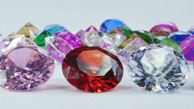 Blue Diamond,tourmaline pink,Amethyst Purple,Citrine Yellow,Iolite smokey blue,
Topaz lighter blue,Peridot green,and colorful gems in white background.
