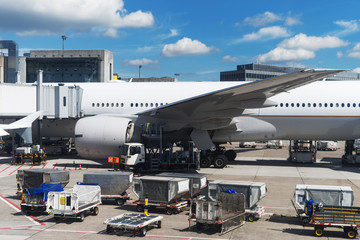 Passenger plane in the airport. Aircraft maintenance.