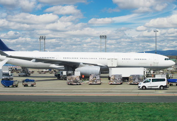 Cargo aircraft is loading at the airport.