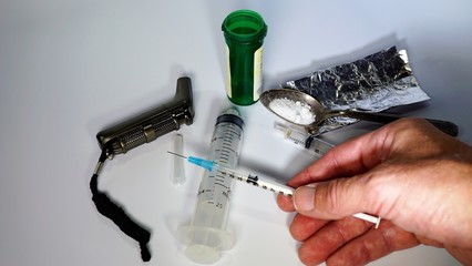 Opioids - Drug Addiction - Opioid Epidemic - Syringe and Drug Paraphernalia.