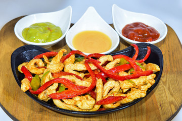 fried chicken and menu with a variety of condiments