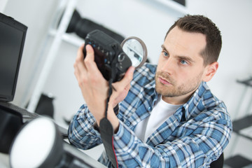 photographer fixing old camera