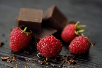 Delicious dark chocolate and ripe pink raspberries 