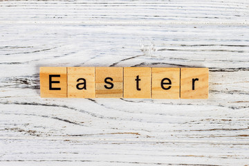 Easter Word In Wooden Cube on the table