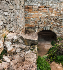 The medieval ruins of the fortress. The passage in the form of a