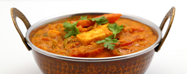 Indian Food or Indian Curry in a copper brass serving bowl.