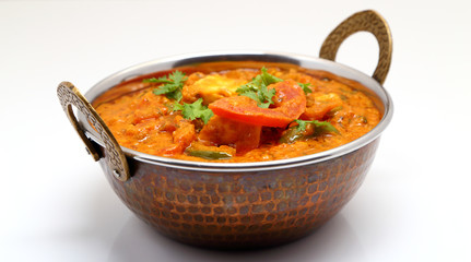 Indian Food or Indian Curry in a copper brass serving bowl.