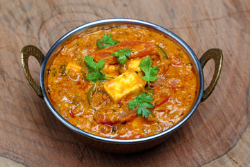 Indian Food or Indian Curry in a copper brass serving bowl.