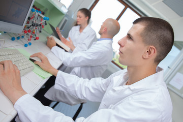 scientist examining dna model in laboratory