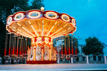 Brightly Illuminated Empty Carousel Merry-Go-Round. Nobody In Su