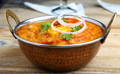 Indian Food or Indian Curry in a copper brass serving bowl.