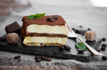 Tiramisu cake on dark background