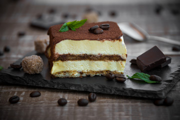 Tiramisu cake on dark background