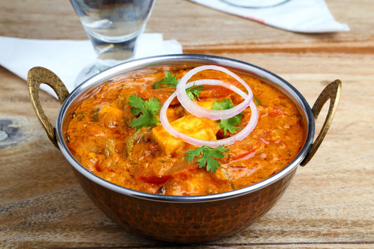 Indian Food or Indian Curry in a copper brass serving bowl.