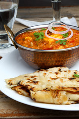 Indian Food or Indian Curry in a copper brass serving bowl.