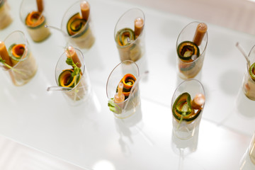 Mini canapes vegetable snacks in plastic cups canapes