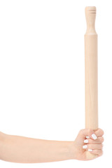 Female hand holding a kitchen rolling pin isolated