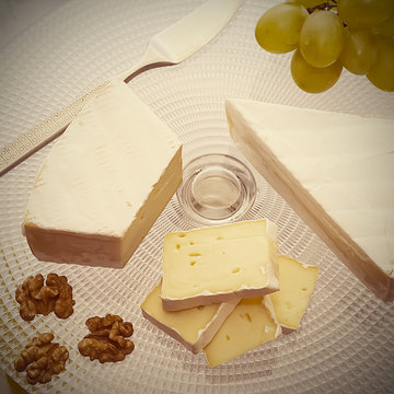 Camembert or brie cheese, walnut and green grapes