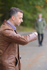 business man watching his wrist watch