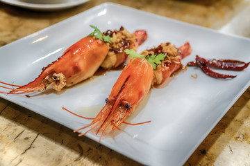 Deep fried prawns in tamarind sauce with herb