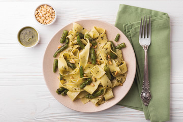 Vegetarian pappardelle pasta with green bean, pesto, pine nuts