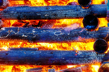 beautiful structure of burning logs and flames of great bonfire.