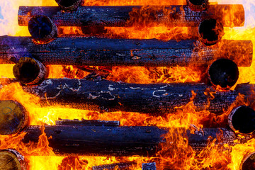 beautiful structure of burning logs and flames of great bonfire.