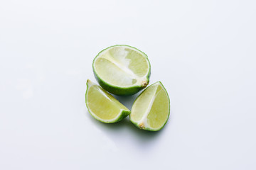 Sliced lime on white background