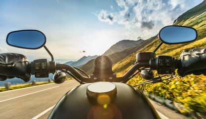 Detail of motorcycle handlebars. Outdoor photography, Alpine landscape