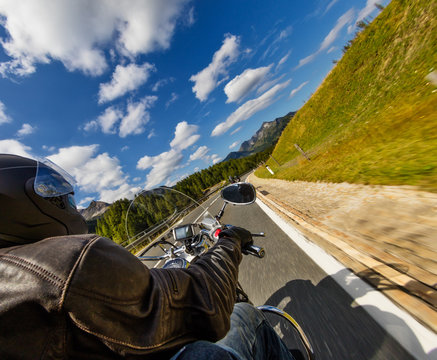 Detail of motorcycle handlebars. Outdoor photography, Alpine landscape