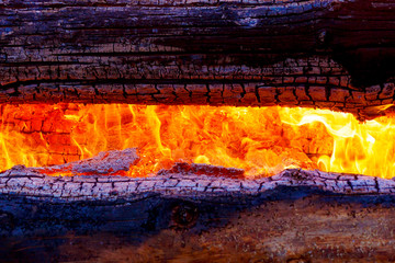 beautiful structure of burning logs and flames of great bonfire.