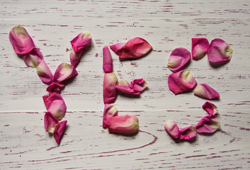 Word yes made of rose petals