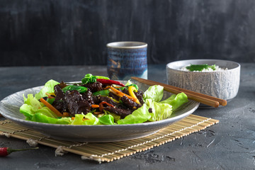 Fried turkey liver asian style with vegetables and many greens. Served with bowl of rice and tea