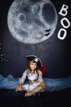 Little girl in pirate costume. Halloween Concept