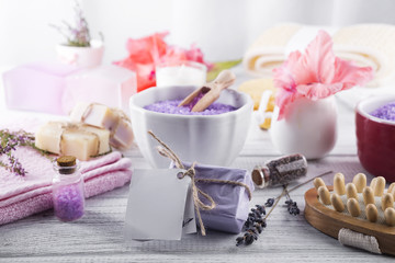 Wellness setting. Sea salt in bowl, towels,