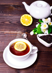 black tea in a white mug with a saucer