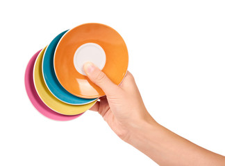 color ceramic plates in hand isolated on white background