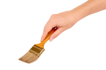 orange Paint brush in hand isolated on white background
