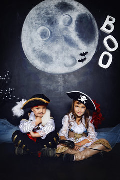 boy and girl in pirate costumes. Halloween Concept