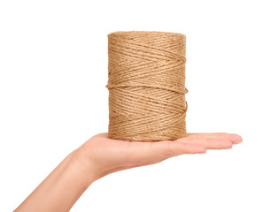 Spool of bale twine isolated in hand on white background