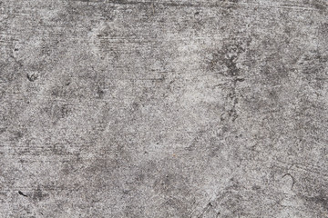 Grunge concrete texture. Grey asphalt road top view photo. Distressed and obsolete background...