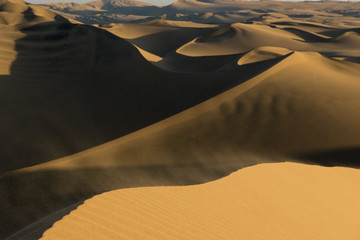 Fototapeta na wymiar Huacachina sand dunes at sunset, in southern Peru