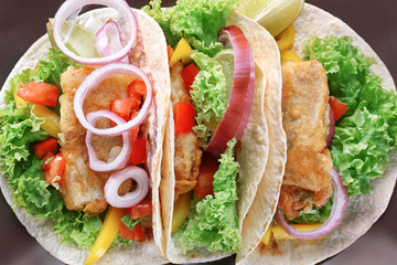 Plate with delicious fish tacos, closeup