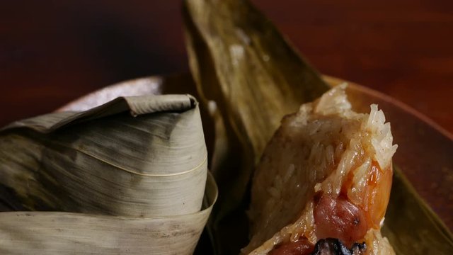 'Zongzi' or 'bakcang', 'bacang' a Chinese traditional food made of glutinous rice  with different fillings and wrapped in bamboo or large leaves.