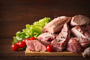 Pieces of different fresh meat on kitchen table