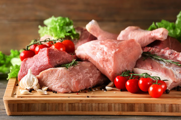 Pieces of different fresh meat on kitchen table