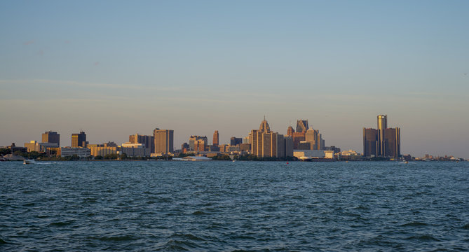 View of downtown Detroit skyline and river at sunset a