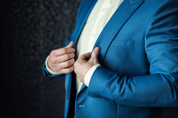 Businessman wears a jacket.Politician, man's style,male hands closeup, American, European businessman, business, fashion and clothing concept