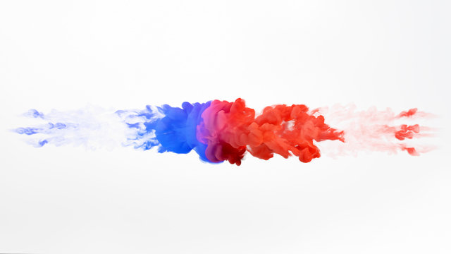 Color paint drops in water. Ink swirling underwater. Cloud of silky ink collision isolated on white background. Colorful abstract smoke explosion. Close up camera view.